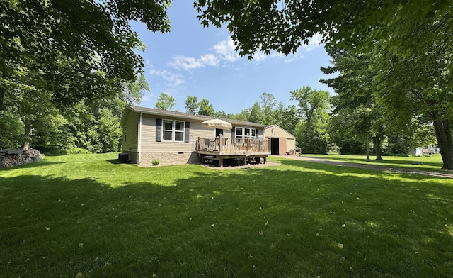38634 241st St, Aitkin, MN 56431 - back of house with a wooden deck, a yard, and crawl space