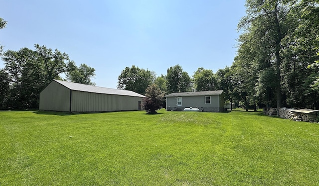 38634 241st St, Aitkin, MN 56431 - view of green lawn with a pole building and an outbuilding