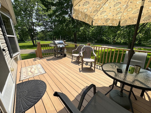 38634 241st St, Aitkin, MN 56431 - deck featuring grilling area, view of scattered trees, and a lawn