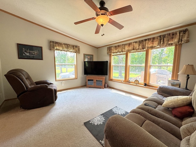 38634 241st St, Aitkin, MN 56431 - living area featuring vaulted ceiling, carpet, baseboards, ornamental molding, and ceiling fan