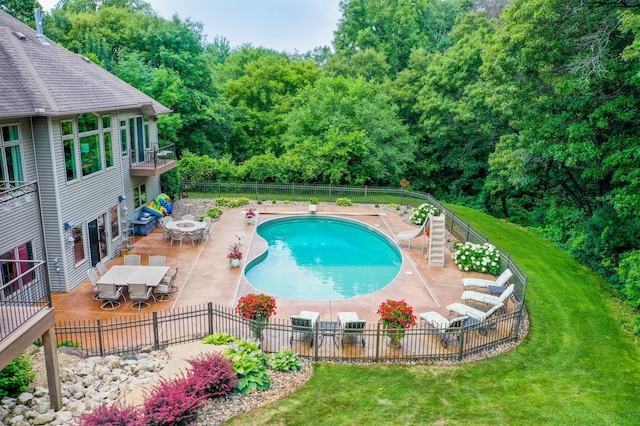 1509 Haller Ct S, Maplewood, MN 55119 - view of swimming pool with a water slide, outdoor dining space, a patio, and a fenced backyard