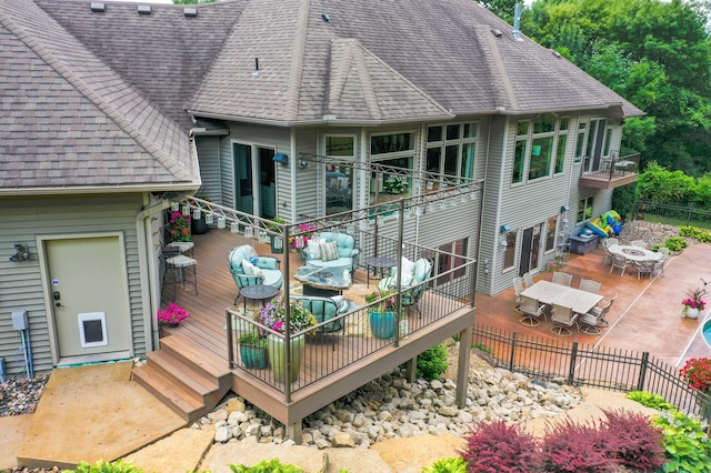 1509 Haller Ct S, Maplewood, MN 55119 - wooden deck featuring outdoor dining area and an outdoor hangout area