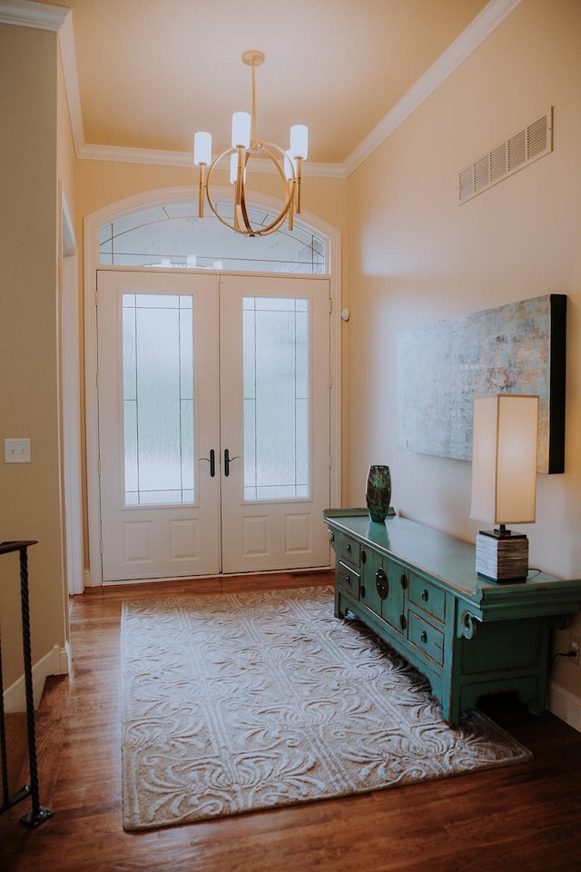1509 Haller Ct S, Maplewood, MN 55119 - entryway with a chandelier, crown molding, plenty of natural light, and wood finished floors