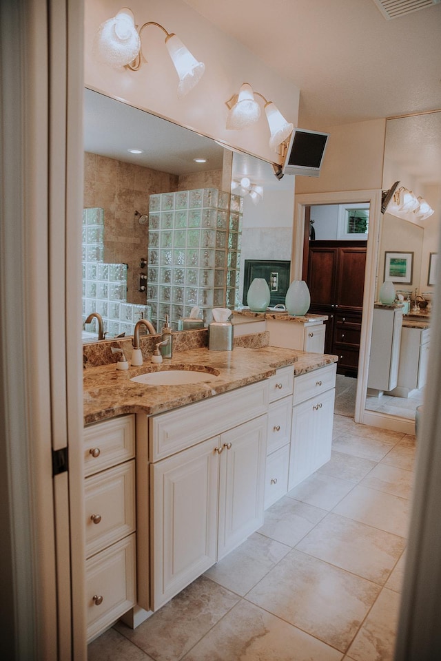1509 Haller Ct S, Maplewood, MN 55119 - bathroom with a tile shower, vanity, and tile patterned flooring