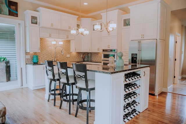 1509 Haller Ct S, Maplewood, MN 55119 - kitchen with light wood-type flooring, white cabinetry, a center island, glass insert cabinets, and crown molding