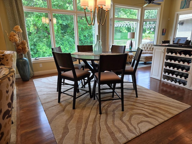 1509 Haller Ct S, Maplewood, MN 55119 - dining space featuring plenty of natural light, wood finished floors, and a chandelier