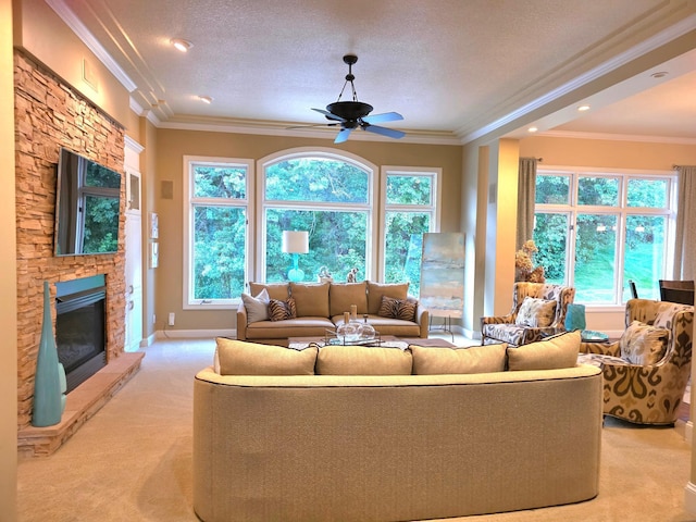 1509 Haller Ct S, Maplewood, MN 55119 - living area featuring light colored carpet, a ceiling fan, a fireplace, ornamental molding, and healthy amount of natural light
