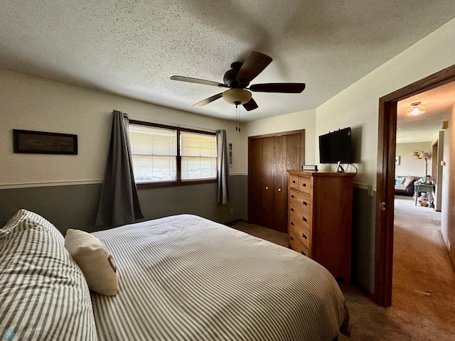 1922 13th Ave N, Moorhead, MN 56560 - bedroom featuring carpet floors, a closet, ceiling fan, and a textured ceiling