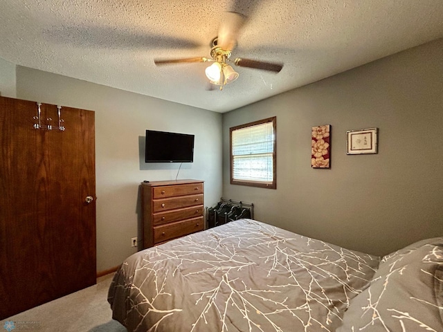 1922 13th Ave N, Moorhead, MN 56560 - bedroom featuring carpet floors, ceiling fan, and a textured ceiling