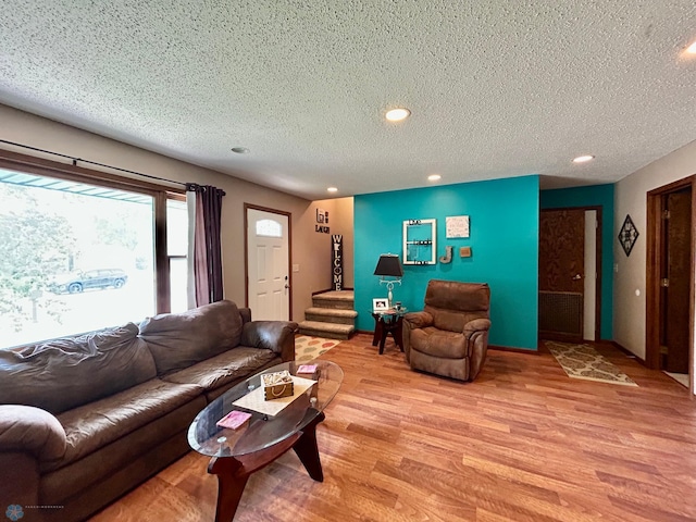 1922 13th Ave N, Moorhead, MN 56560 - living room featuring a textured ceiling, light wood-style floors, and recessed lighting