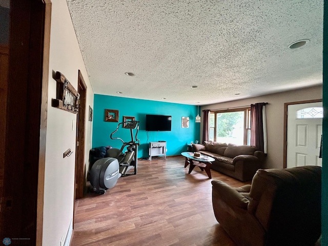 1922 13th Ave N, Moorhead, MN 56560 - living area with a textured ceiling and wood finished floors