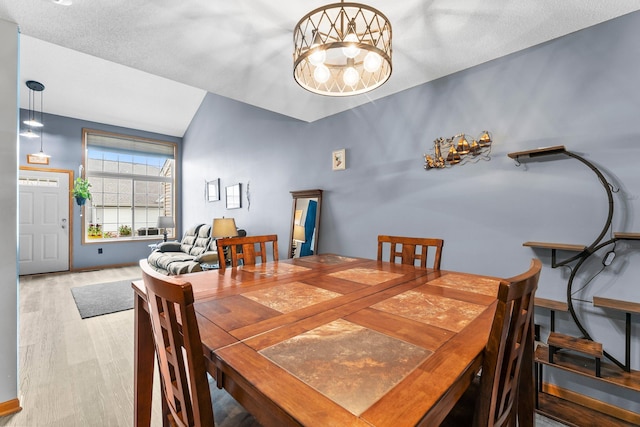 315 Roosevelt St S Unit B, Cambridge, MN 55008 - dining space featuring wood finished floors, a chandelier, and baseboards