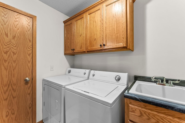 315 Roosevelt St S Unit B, Cambridge, MN 55008 - washroom with cabinet space, washer and dryer, and a textured ceiling