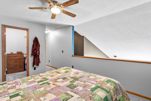 315 Roosevelt St S Unit B, Cambridge, MN 55008 - bedroom with a textured ceiling, carpet flooring, baseboards, vaulted ceiling, and ceiling fan