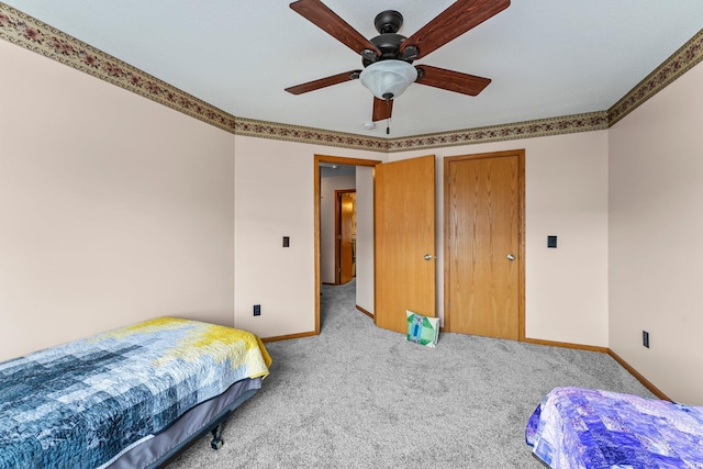 315 Roosevelt St S Unit B, Cambridge, MN 55008 - carpeted bedroom featuring baseboards and a ceiling fan