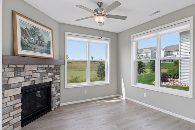 1250 Naser Way, New Richmond, WI 54017 - unfurnished living room featuring plenty of natural light, light wood finished floors, and ceiling fan