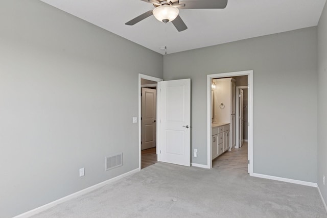 1250 Naser Way, New Richmond, WI 54017 - unfurnished bedroom with light colored carpet, ensuite bathroom, and ceiling fan