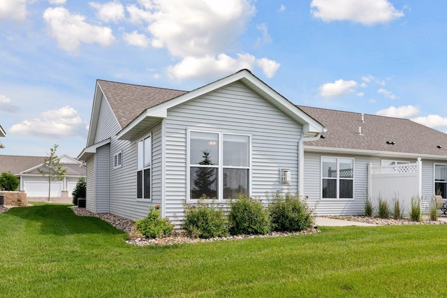 1250 Naser Way, New Richmond, WI 54017 - rear view of property featuring a lawn and roof with shingles