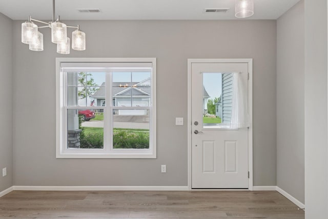 1250 Naser Way, New Richmond, WI 54017 - entrance foyer featuring wood finished floors and a chandelier
