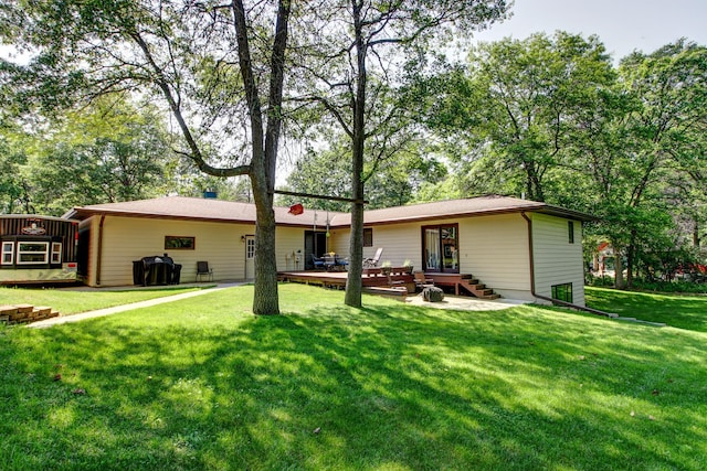 305 Birch Briar Ln, Park Rapids, MN 56470 - rear view of property featuring a wooden deck and a yard
