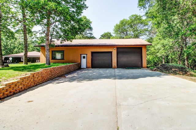 305 Birch Briar Ln, Park Rapids, MN 56470 - view of front facade featuring a metal roof, a garage, and driveway