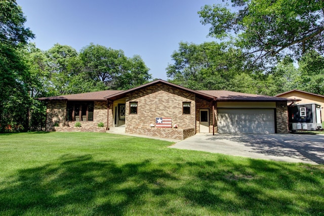 305 Birch Briar Ln, Park Rapids, MN 56470 - view of front of property with a garage, concrete driveway, a front lawn, and brick siding
