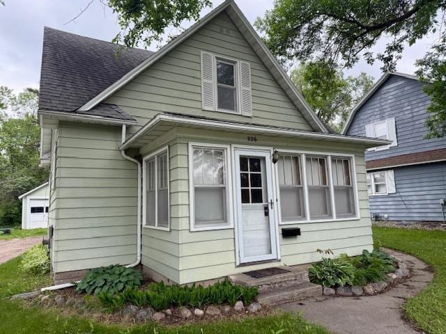 926 Park St, Fergus Falls, MN 56537 - rear view of house with a shingled roof