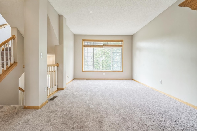 8812 Brunswick Path, Inver Grove Heights, MN 55076 - carpeted spare room with baseboards and a textured ceiling