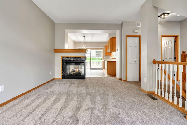 8812 Brunswick Path, Inver Grove Heights, MN 55076 - unfurnished living room with light colored carpet and a multi sided fireplace