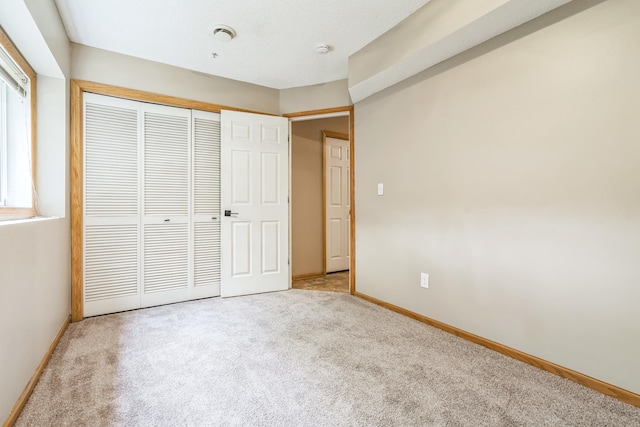 8812 Brunswick Path, Inver Grove Heights, MN 55076 - unfurnished bedroom featuring carpet and a closet