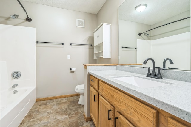 8812 Brunswick Path, Inver Grove Heights, MN 55076 - bathroom featuring vanity, tub / shower combination, a textured ceiling, and stone finish floors