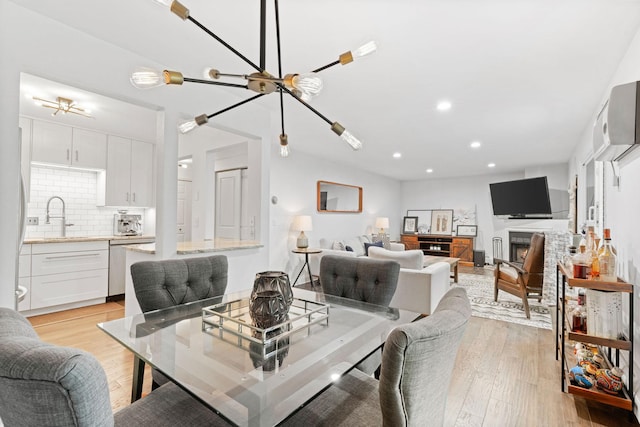 3850 Plymouth Blvd Unit 212, Plymouth, MN 55446 - dining room with light wood finished floors, recessed lighting, and a chandelier