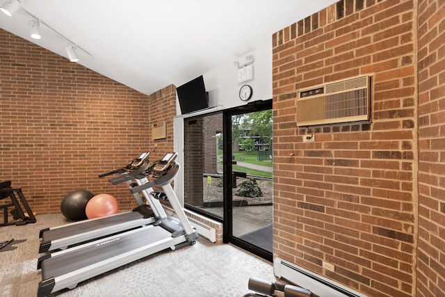3850 Plymouth Blvd Unit 212, Plymouth, MN 55446 - workout room with brick wall, lofted ceiling, a wall unit AC, a baseboard heating unit, and rail lighting