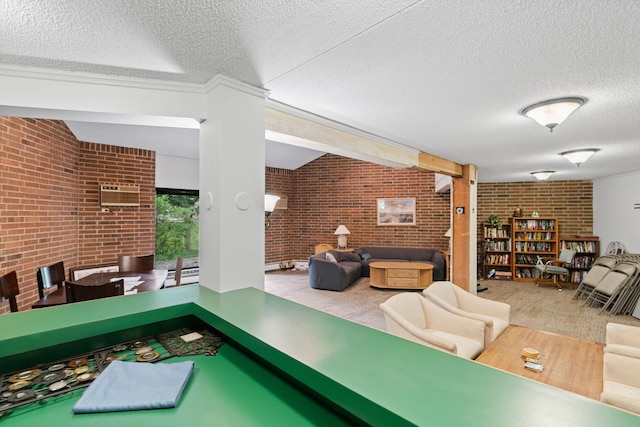 3850 Plymouth Blvd Unit 212, Plymouth, MN 55446 - recreation room with brick wall, a textured ceiling, carpet flooring, and an AC wall unit