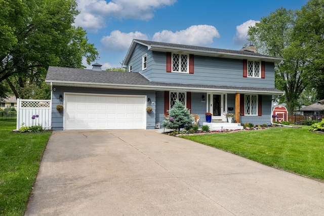 3940 Virginia Ave N, New Hope, MN 55427 - view of front of home with a chimney, a porch, a garage, and concrete driveway