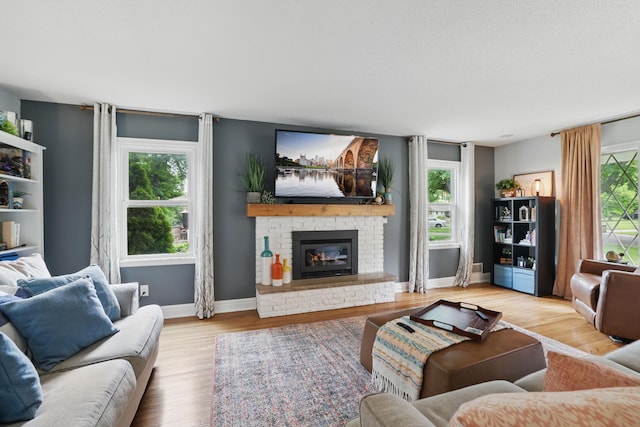 3940 Virginia Ave N, New Hope, MN 55427 - living area with a fireplace and wood finished floors