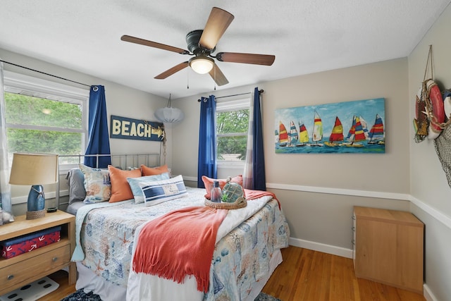 3940 Virginia Ave N, New Hope, MN 55427 - bedroom with wood finished floors and a ceiling fan