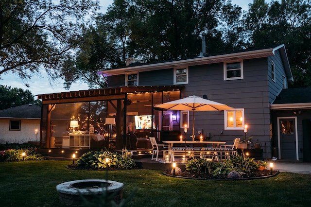 3940 Virginia Ave N, New Hope, MN 55427 - rear view of house with an outdoor fire pit and a yard