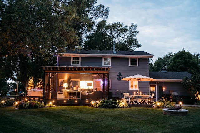 3940 Virginia Ave N, New Hope, MN 55427 - back of house featuring a fire pit, a deck, and a yard