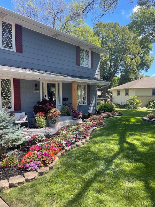 3940 Virginia Ave N, New Hope, MN 55427 - view of front of house with a porch and a front lawn