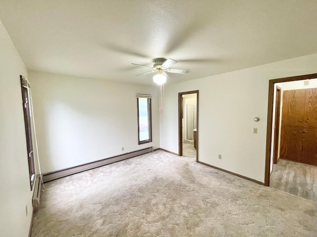 605 13th St, Mountain Lake, MN 56159 - unfurnished bedroom with a baseboard heating unit, light colored carpet, baseboards, and ensuite bath