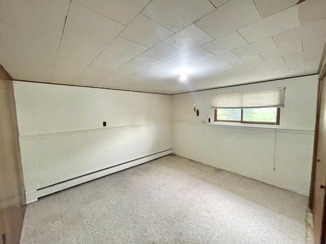 605 13th St, Mountain Lake, MN 56159 - basement featuring a baseboard heating unit and concrete block wall