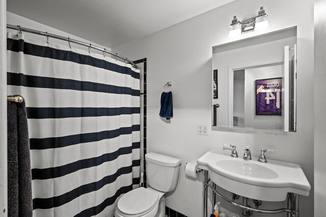 1901 Emerson Ave S Unit 303, Minneapolis, MN 55403 - bathroom featuring toilet and a shower with shower curtain