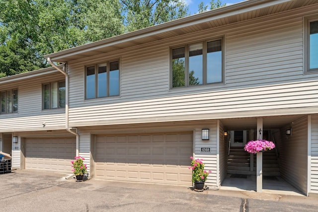 6368 Pheasant Ct, Edina, MN 55436 - view of front of house featuring an attached garage and driveway