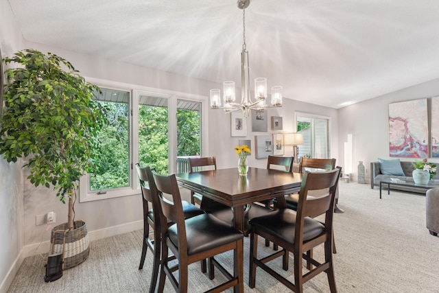 6368 Pheasant Ct, Edina, MN 55436 - dining space featuring a chandelier, light carpet, baseboards, and healthy amount of natural light