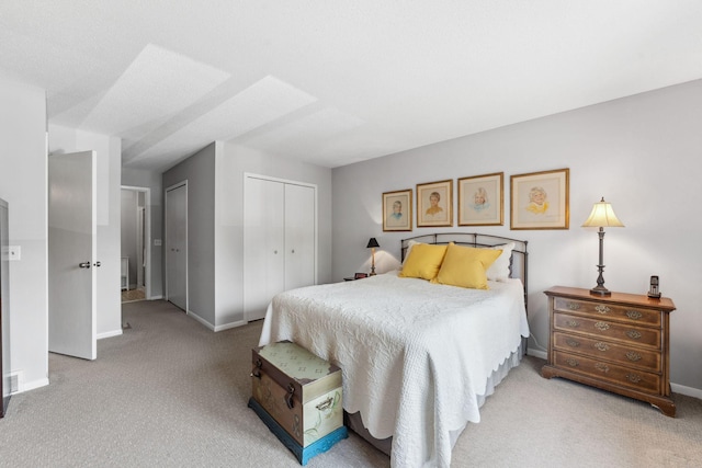 6368 Pheasant Ct, Edina, MN 55436 - bedroom featuring light colored carpet, baseboards, and multiple closets
