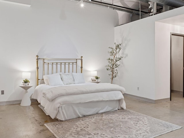 730 Stinson Blvd Unit 106, Minneapolis, MN 55413 - bedroom featuring concrete floors and a towering ceiling