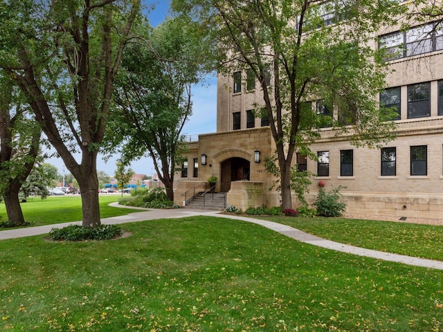 730 Stinson Blvd Unit 106, Minneapolis, MN 55413 - view of front of home with a front lawn and brick siding