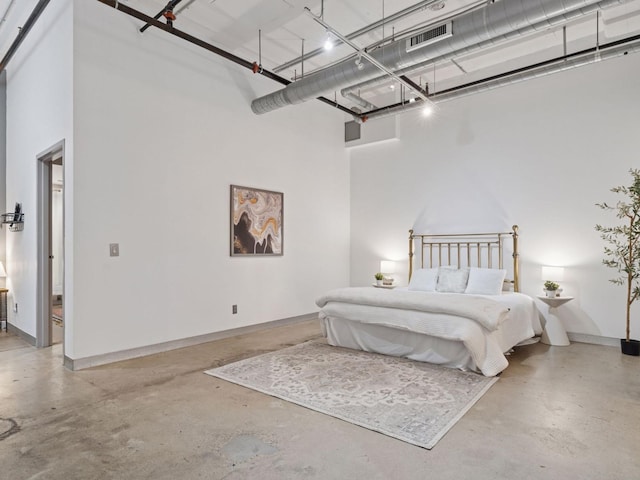 730 Stinson Blvd Unit 106, Minneapolis, MN 55413 - bedroom with a garage, concrete flooring, and a high ceiling