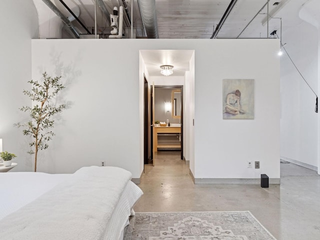 730 Stinson Blvd Unit 106, Minneapolis, MN 55413 - bedroom with finished concrete flooring, ensuite bathroom, and a high ceiling